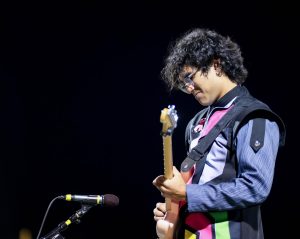 Soloist Zach Gutierrez plays the Guitar and Tuba in The Maze

