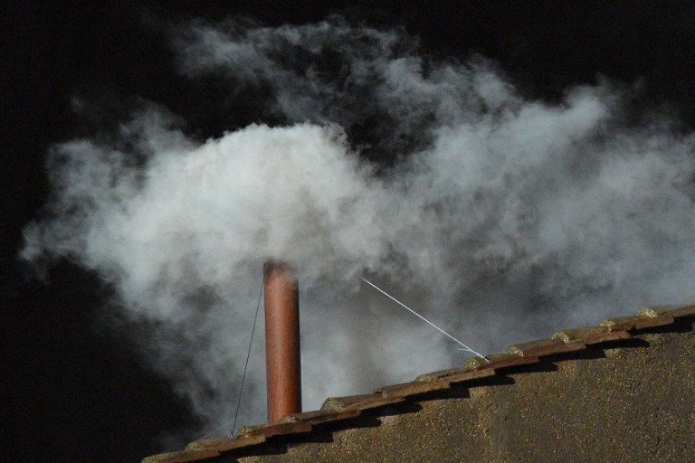 White smoke rises from the chimney on the roof of the Sistine Chapel meaning that cardinals elected a new pope on the second day of their secret conclave on  March 13, 2013 at the Vatican.    AFP PHOTO / VINCENZO PINTO